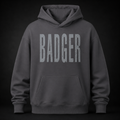 Oversized Hoodie in der Farbe Magnet mit distressed BADGER Schriftzug auf der Vorderseite