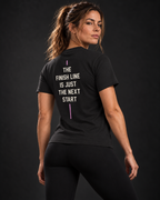 BADGER47 FORGED Damen-T-Shirt UNSTOPPABLE in Schwarz – Rückseite mit THE FINISH LINE IS JUST THE NEXT START Print